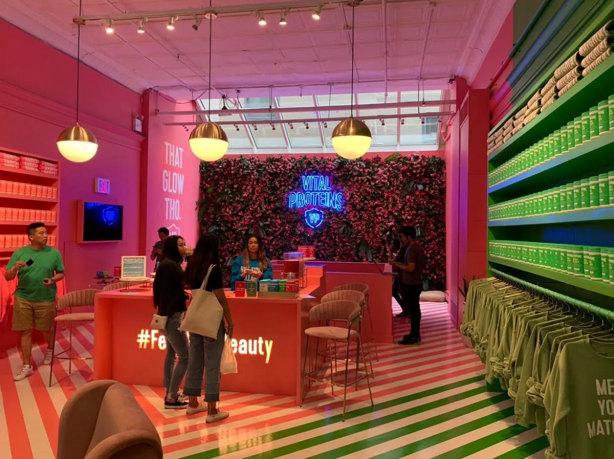 What appears to be a store with bright pink and green walls and floors with green and pink stripes.