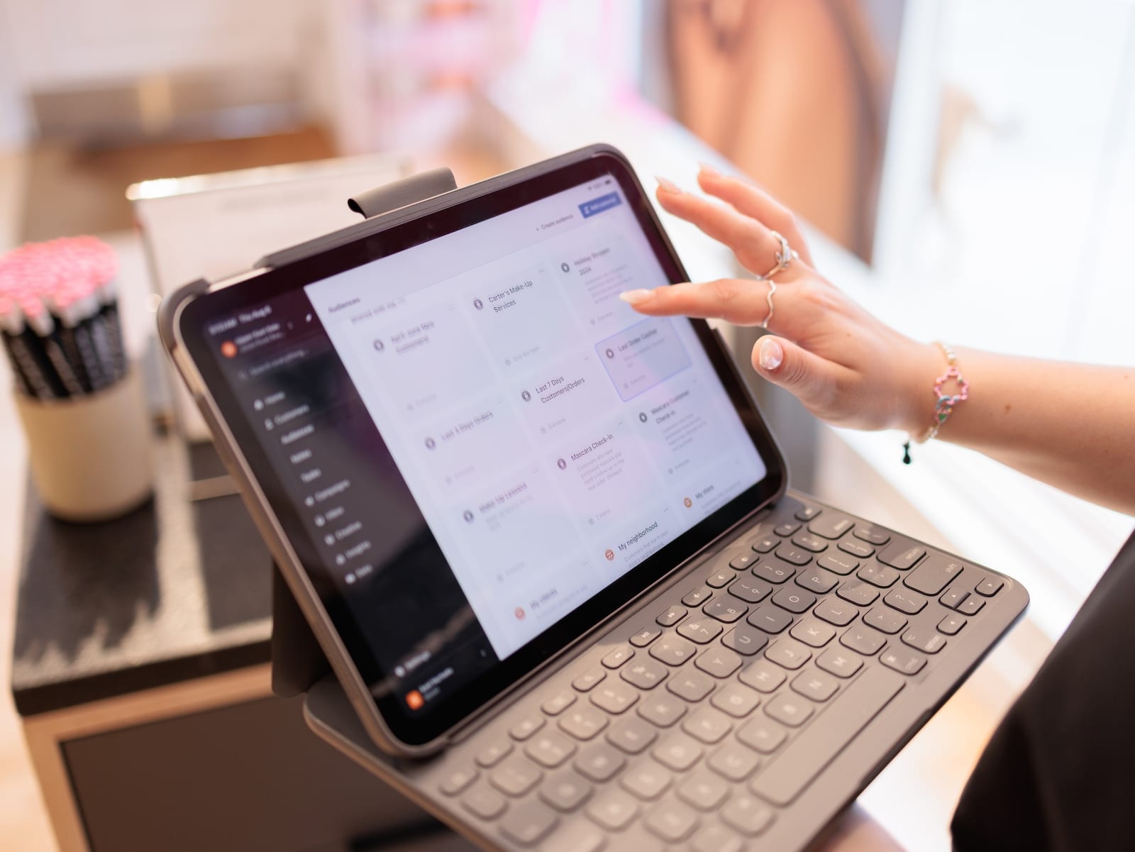 Endear's audience list open on an iPad on a store counter